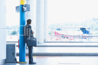 Indian businessman waiting bus