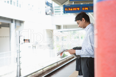 Indian business man waiting train