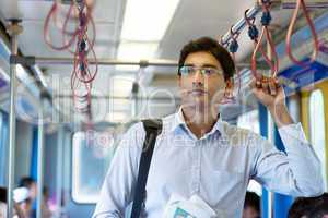 Indian businessman inside train.