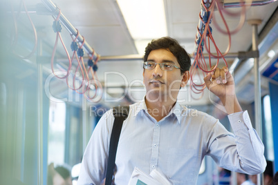 Indian business man inside train.