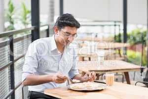 Indian businessman eating food