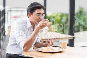 Indian business man eating food