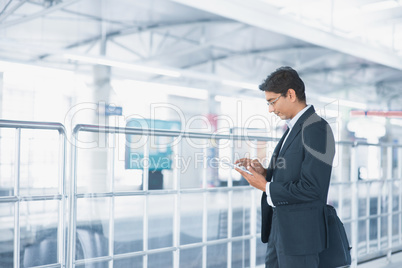 Indian businessman using tablet computer