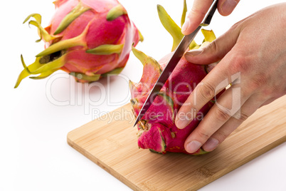 Knife In Position For a First Cut Through A Pitaya