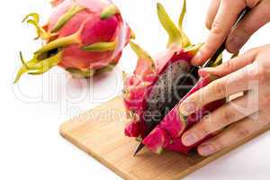 Opening A Ripe Dragonfruit With A Longitudinal Cut
