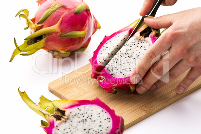 Cutting Off A First Fruit Chip From A Pitaya Half