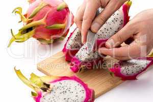 Knife Positioned To Peel A Pitaya Fruit Wedge