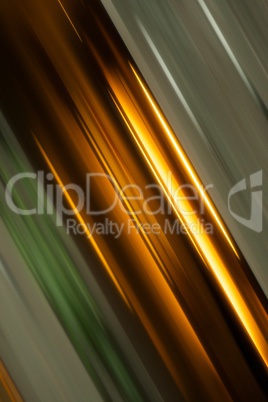 Abstract angled streaks of green and gold