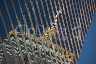 Angled reflection of Central Plaza in skyscraper