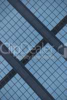 Angled view of blue glass building facade
