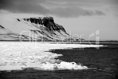 Black and white cliffs in Arctic Ocean
