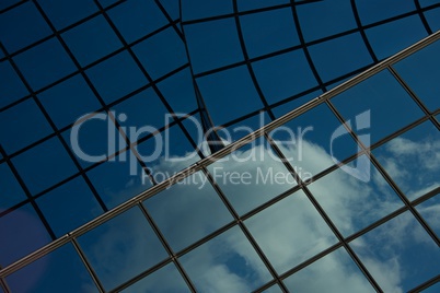 Blue sky and cloud reflected in windows