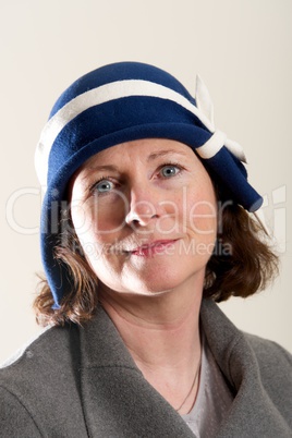 Brunette in blue and white cloche hat