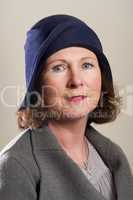 Brunette in blue cloche hat and jacket