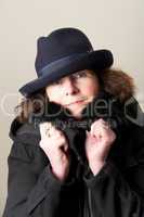 Brunette in blue hat and black jacket
