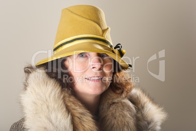 Brunette in yellow felt hat and fur