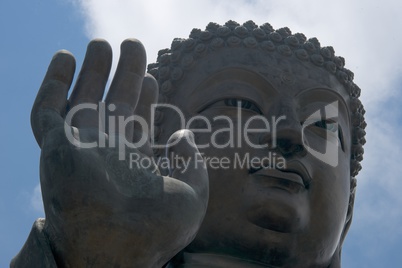 Close-up of Big Buddha hand and face