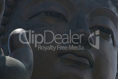 Close-up of Big Buddha thumb and face