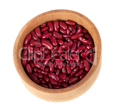 Red haricot in wooden bowl isolated on white background