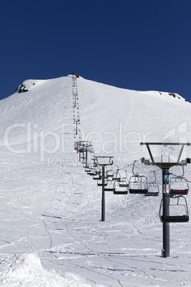 Winter mountains and ski slope at nice day