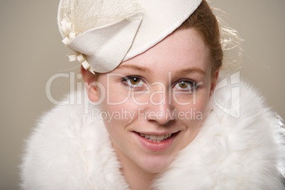 Close-up of redhead in hat and fur