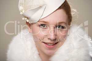 Close-up of redhead in hat and fur