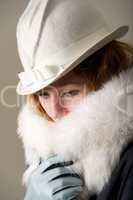 Close-up of serious redhead in white hat