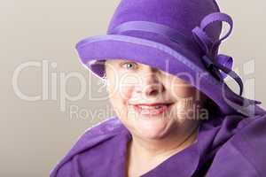 Close-up of white-haired woman in purple hat