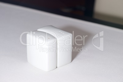 Curved white china salt and pepper shakers