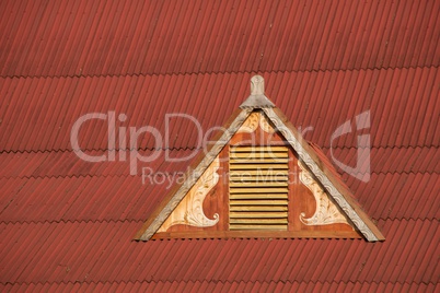 Dormer window in red corrugated iron roof