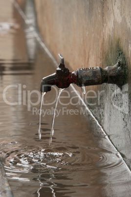 Dripping tap in street