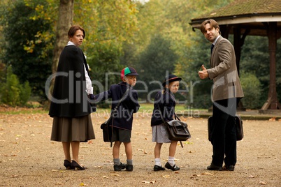 Family of four in park beside bandstand