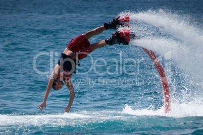 Flyboarder in red about to hit water