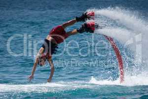 Flyboarder in red about to hit water
