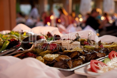 Grilled vegetables in restaurant buffet with diners