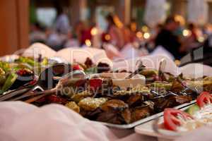 Grilled vegetables in restaurant buffet with diners