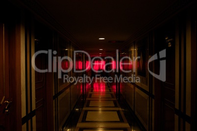 Hotel corridor bathed in red light