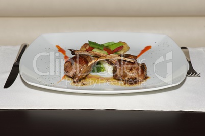 Lamb cutlets with vegetables and place setting