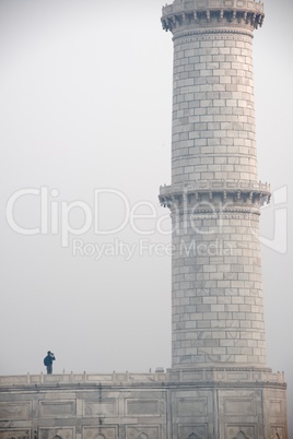Man photographing Taj minaret