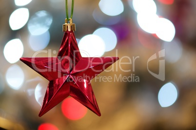 Red star with bokeh Xmas tree lights