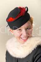 Redhead in black and red hat with fur