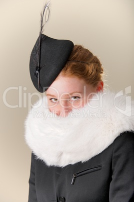 Redhead in black hat and white fur