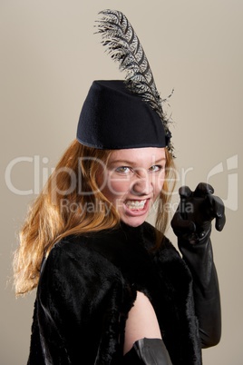 Redhead in black hat pretending to snarl