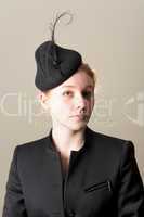 Redhead in black jacket and feathered hat