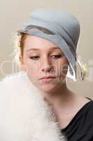 Redhead in blue hat and white fur