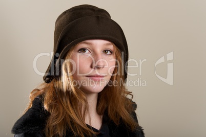 Redhead in brown cloche hat and jacket