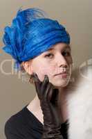 Redhead in blue hat with leather glove