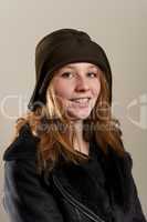 Redhead in cloche hat and leather jacket