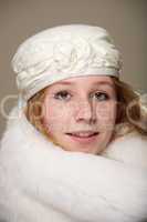 Redhead in cream hat and white fur