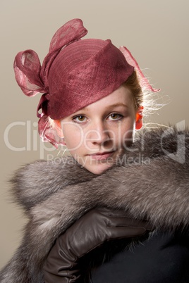 Redhead in red hat with leather glove